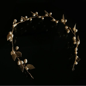 Handmade golden bridal headband with white pearls and delicate metal vine leaves