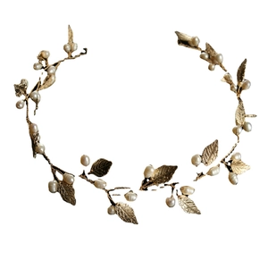 Vintage bridal headband with gold metal leaves and white pearls for wedding hairstyles