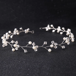 Elegant bridal hair vine with white pearls and sparkling rhinestones on silver wire
