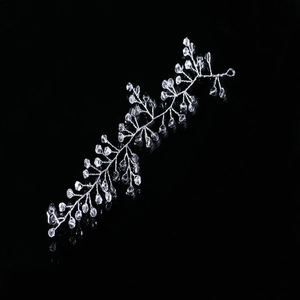 Close-up of silver crystal hair vine with metal wire branches for wedding hairstyles