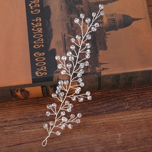 Silver crystal bead headband hair accessory for brides and girls on vintage book