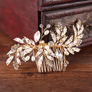 Elegant gold bridal hair comb with vintage white leaves, rhinestones and pearls