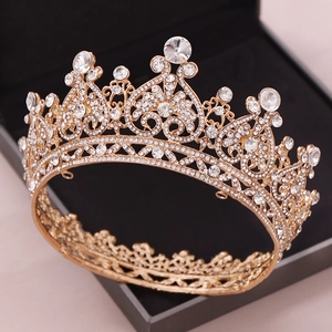 Elegant gold bridal crown with heart patterns and white rhinestones for wedding decor