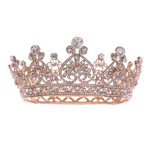 Macro detail of vintage gold heart tiara with sparkling crystal rhinestones for brides