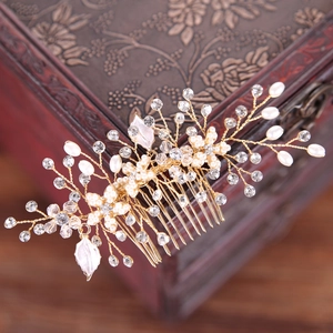Handmade bridal hair comb with gold base, white pearls, crystals and leaf details