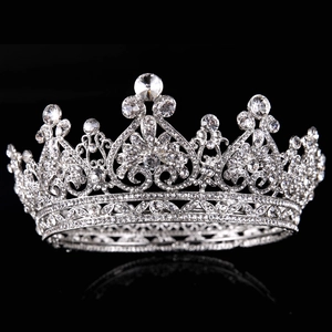 Luxurious bridal tiara with silver rhinestones and heart pattern on black background