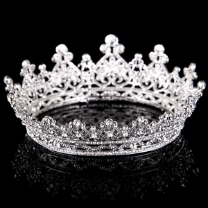 Detailed view of silver bridal crown with heart patterns and shimmering rhinestones