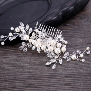 Handmade bridal hair comb with white pearls and crystals on a silver metal base