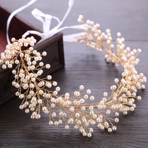 Handmade gold bridal hair vine with cream pearls and white silk ribbon for weddings