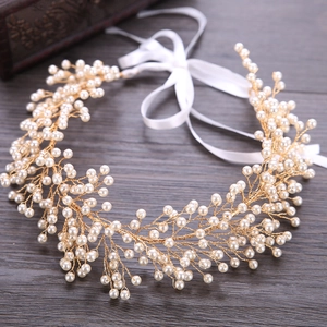 Handmade bridal pearl headband with golden wire and elegant white satin ribbons
