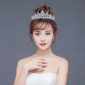 Close-up of elegant bridal crown with sparkling rhinestones on a bride model