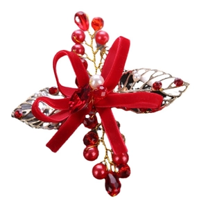 Handmade red velvet bow hair clip with gold leaves, pearls, and red crystals for brides
