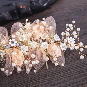 Elegant floral hairband with white pearls, gold metal leaves, and a soft tulle bow for girls