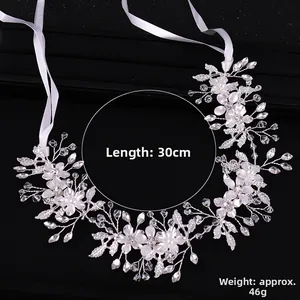 Detailed view of handmade silver bridal headband with pearls, crystals and flowers