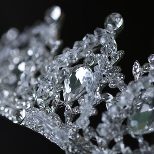 Macro detail of silver bridal crown featuring pear-cut crystals and pavé rhinestones