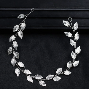 Elegant silver leaf headband accessory for weddings with detailed metal foliage texture