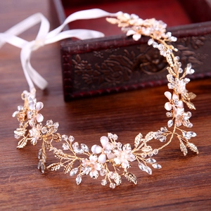 Golden bridal leaf headband with pink flowers and crystal embellishments for wedding dresses