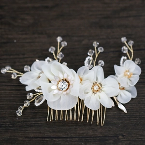 Exquisite bridal hair comb with ivory tulle flowers, pearls, and crystals on gold wire