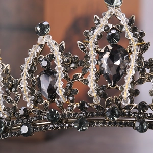 Detailed macro view of vintage gunmetal crown with dark grey teardrop crystals