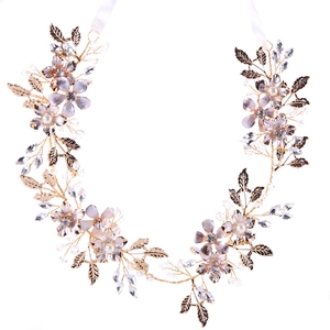 Handmade gold leaf bridal headband with light purple flowers and pearls on white ribbons