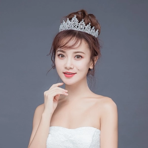 Elegant bridal tiara with sparkling crystal rhinestones on a model for wedding occasions