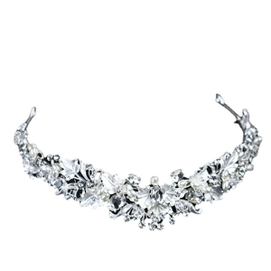 Elegant bridal silver tiara with crystals pearls and metallic leaf motifs on white background