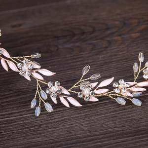 Exquisite bridal leaf headband with pink floral petals, pearls and golden wire design