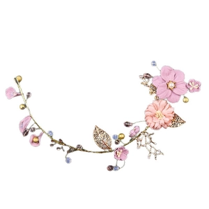Serre-tête de mariée élégant avec fleurs en tissu rose et détails de vigne dorés
