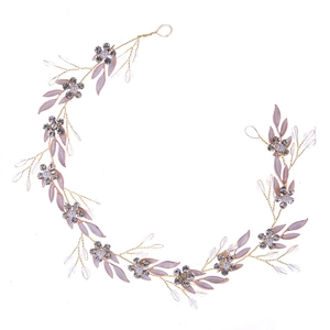 Elegant gold bridal hair vine with pink leaves, rhinestones and crystal beads for weddings