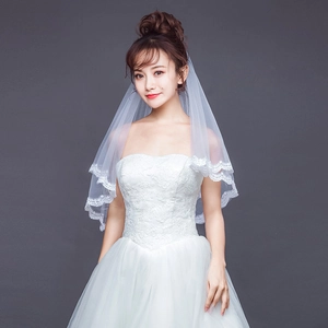 Elegant two-tier white bridal veil with delicate lace edges and sheer mesh texture