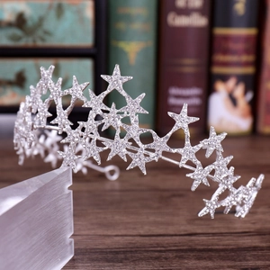 Macro shot of sparkling silver star crown with rhinestone crystals for wedding accessories