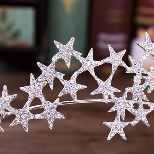 Detailed macro view showing silver star crown with shimmering rhinestones for weddings