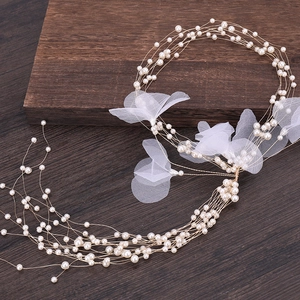 Elegant multi-layer pearl hairband with white organza flowers for wedding hairstyles