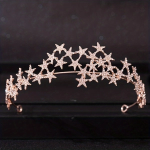 Elegant rose gold star bridal crown with sparkling rhinestones for wedding hair styling