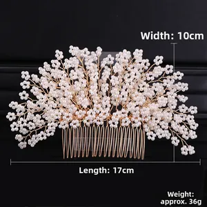 Detailed macro view of handmade gold pearl hair comb with branch floral design