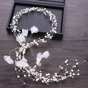 Elegant multi-layer pearl headband with white tulle petals for bridal wedding hair styling