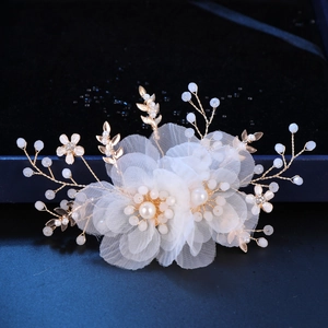 Elegant white floral bridal hair clip with mesh petals, pearls and gold leaves