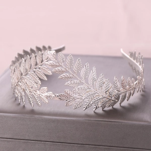 Retro silver leaf crown headband with detailed laurel leaf design on jewelry box