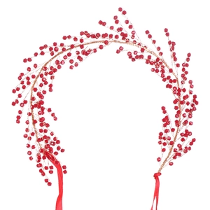 Handmade bridal headband with red beads and leaf-shaped wire branches on white background