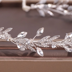 Macro detail of bridal silver leaf headband with shimmering rhinestones and alloy wire