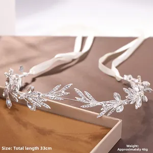 Detail view of silver leaf bridal headband with rhinestones and ribbon, 33cm in length