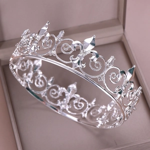 Elegant silver bridal crown with fleur-de-lis pattern in a velvet jewelry box