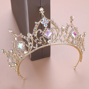 Macro detail of gold Baroque bridal crown featuring luxury iridescent AB crystals
