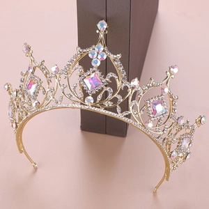 Close-up of golden crystal crown showing intricate filigree and AB rhinestones