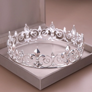 Detailed close-up of a silver rhinestone bridal crown in a premium velvet jewelry box
