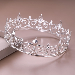 Elegant silver bridal tiara crown with hollow iris pattern and sparkling rhinestones