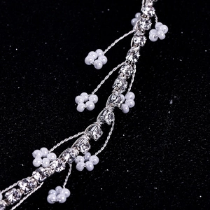 Elegant bridal hair band with silver wire leaves, white beads and sparkling crystals