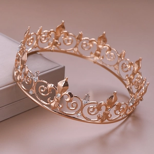 Detailed macro view of rose gold bridal tiara with fleur-de-lis crystal patterns
