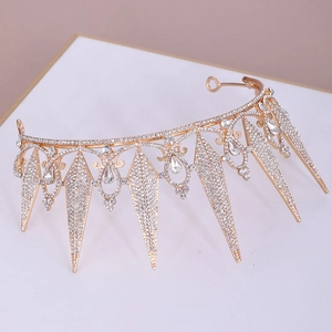 Macro detail of golden bridal crown with sparkling crystal rhinestones and pointed geometry