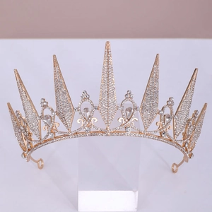 Close-up of golden bridal crown with clear crystal rhinestones and teardrop jewels